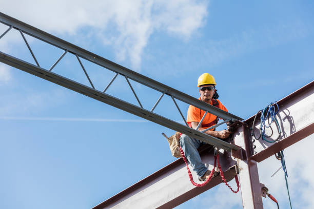 istock Ironworker at construction site installing roof joist 1211076277