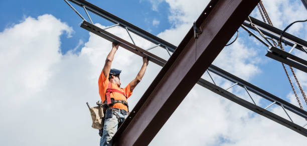 istock Ironworker at construction site installing roof joist 1211076985