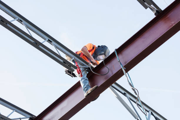 istock Ironworker at construction site installing roof joist 1211077027