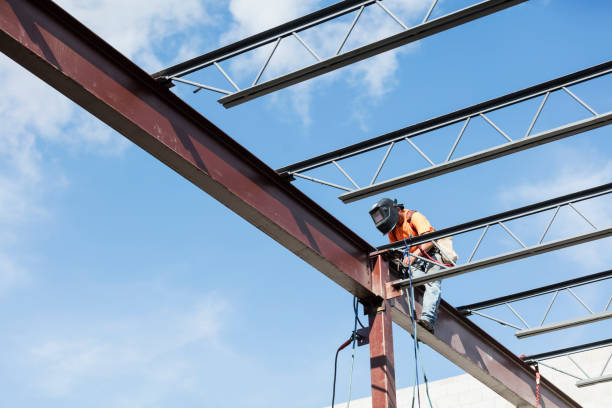istock Ironworker at construction site installing roof joist 1211077029