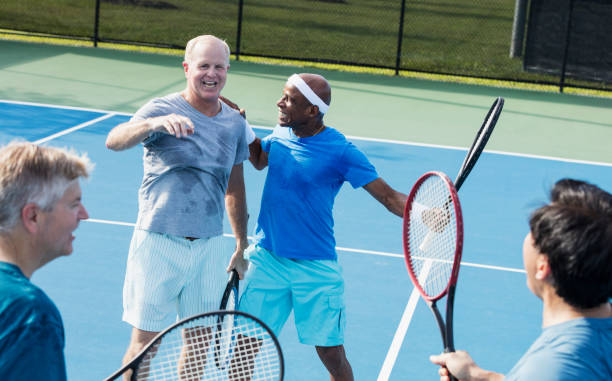 istock Men playing tennis, meeting at the net 1211078588