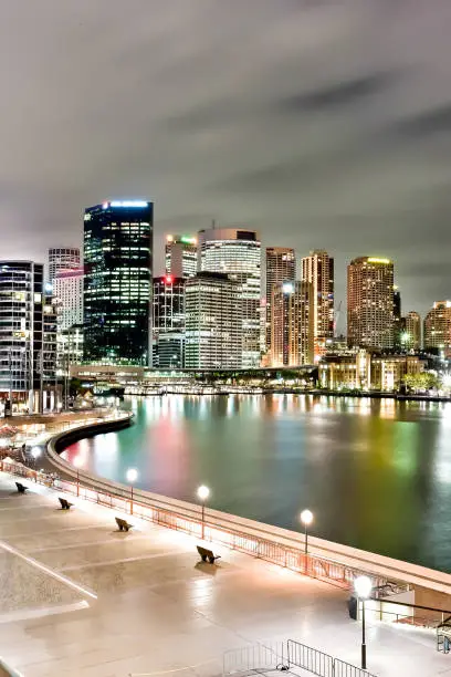 Photo of Sydney city and the river with lights on buildings