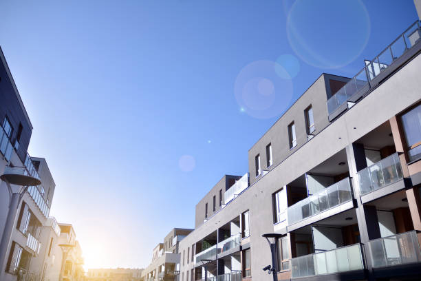 istock Modern multi story building being lit by the setting sun at afternoon. 1211089264
