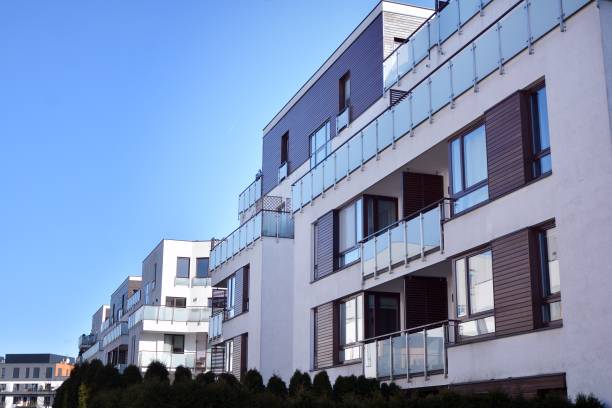 istock Modern multi story building being lit by the setting sun at afternoon. 1211089876
