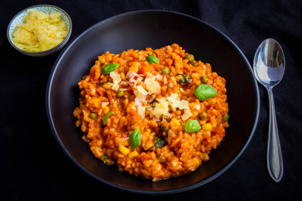 istock Risotto with tomatoes, fresh herbs and parmesan cheese 1211090921