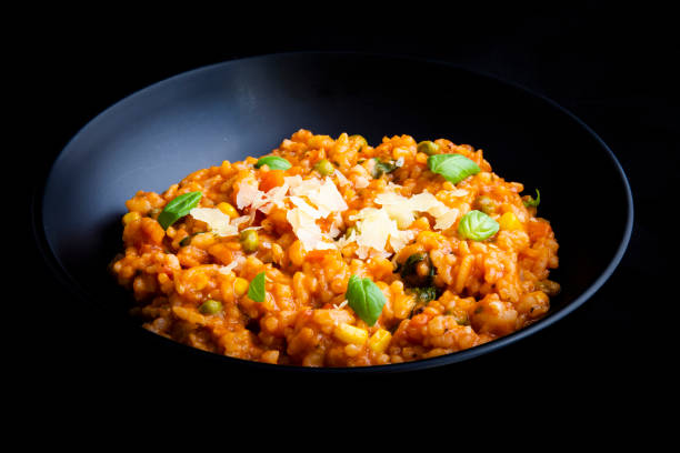 istock Risotto with tomatoes, fresh herbs and parmesan cheese 1211090928