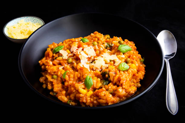 istock Risotto with tomatoes, fresh herbs and parmesan cheese 1211091035