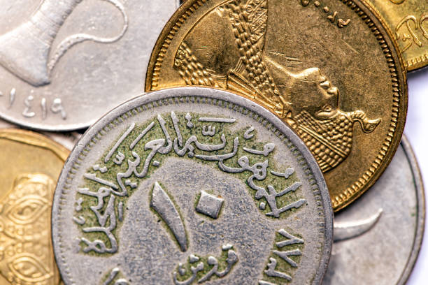 istock Coins of different arab countries closeup 1211094888
