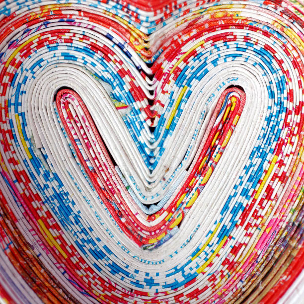 heart heart shape of recycled rolled newspaper pages, detail abstract newspaper macro heart shape stock pictures, royalty-free photos & images
