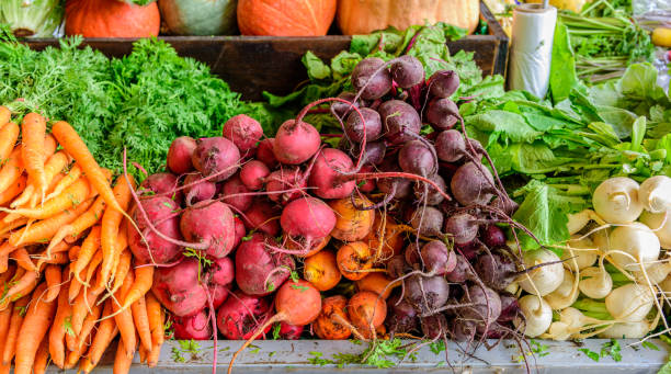 A fruit and vegetable stall A fruit and vegetable stall at the South Melbourne Market with produce on display in the city of Melbourne Australia agricultural fair photos stock pictures, royalty-free photos & images