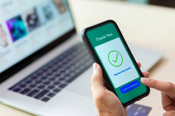 istock using smartphone and laptop online shopping 1211098158