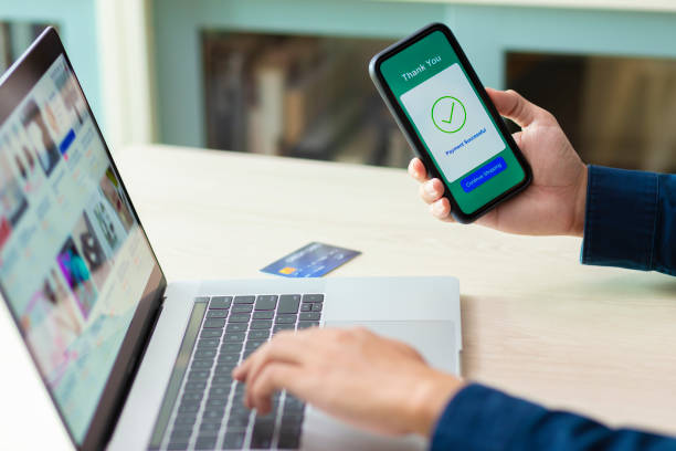 istock using smartphone and laptop online shopping 1211098182