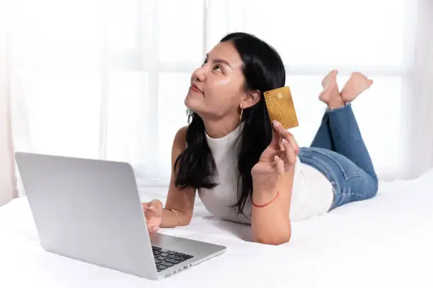 Asian woman buying online.