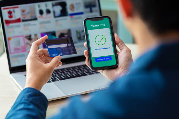 istock using smartphone and credit card online shopping 1211098246