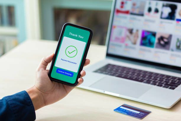istock using smartphone and credit card online shopping 1211099084