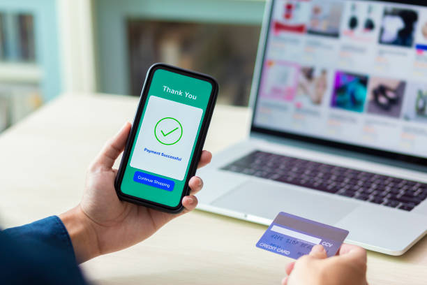 istock using smartphone and credit card online shopping 1211099147