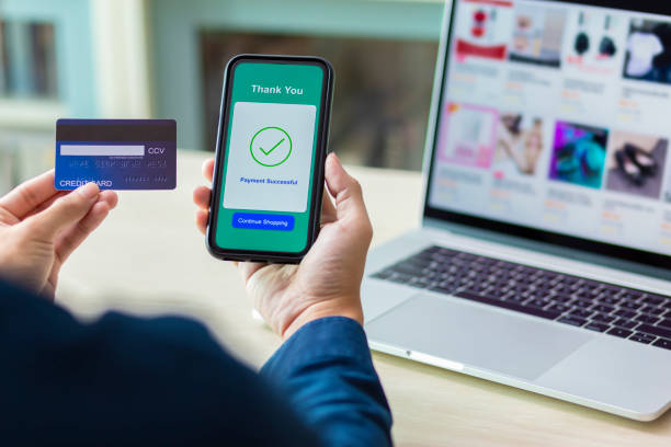 istock using smartphone and credit card online shopping 1211099225