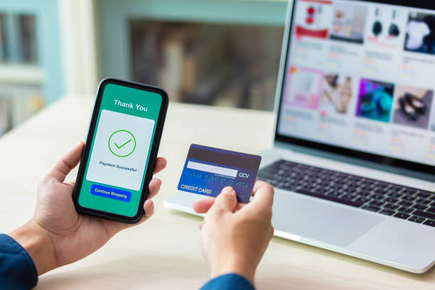 istock using smartphone and credit card online shopping 1211099236