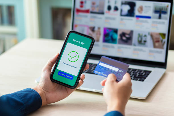 istock using smartphone and credit card online shopping 1211099253