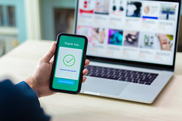 istock using smartphone and laptop online shopping 1211099270