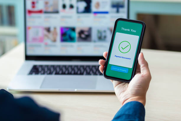 istock using smartphone and laptop online shopping 1211099302