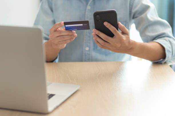 istock using smartphone and credit card online shopping 1211100903