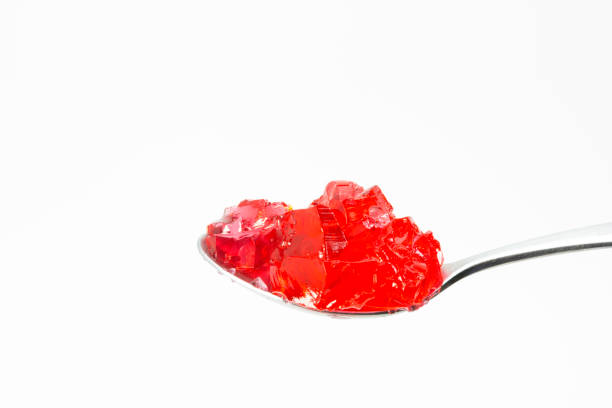 istock spoonful strawberry flavor jelly with white background 1211101252