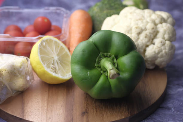 Close up of fresh vegetable on shopping board.
