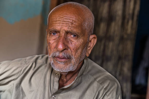 istock arab elderly man sitting inside a dark room with sad expression after loosing his homeland 1211101618
