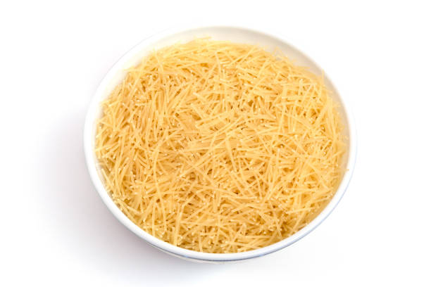 istock Vermicelli pasta in a wood bowl. white background 1211104276