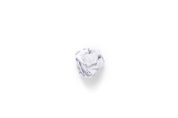 Crumpled white a4 paper was shot in studio light on white background. This means no idea or fail plan concept. Clipping path.