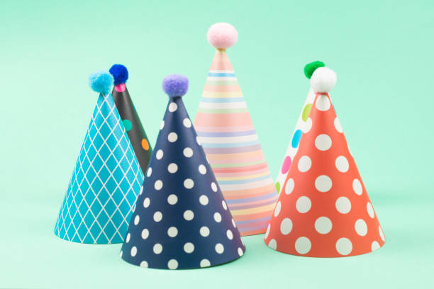 istock Colorful birthday caps on mint background. 1211107990