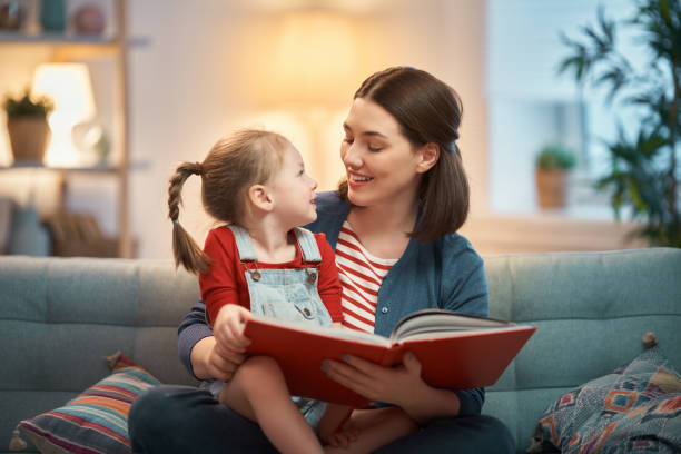 istock mother reading a book to daughter 1211109014