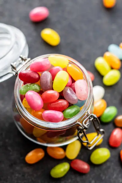 Fruity jellybeans. Tasty colorful jelly beans in glass jar.