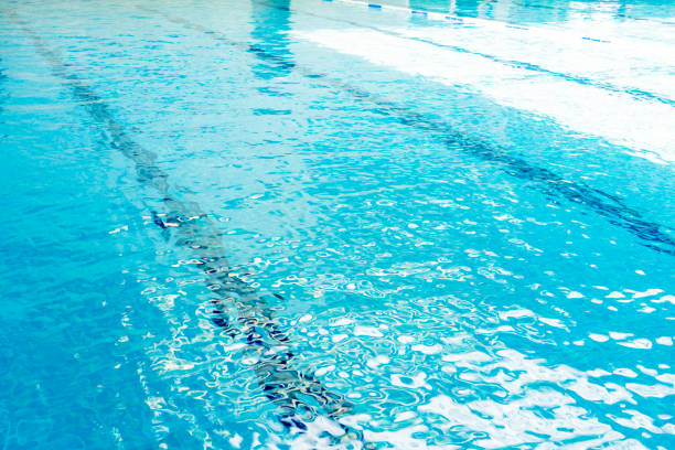 istock Guide line under the pool In case helping the swimmer to have a landmark and surface blue water background 1211110635