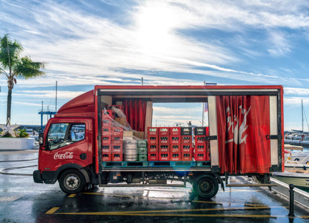 23th December 2019 - Puerto Banus, Spain. Red Coca Cola delivery truck distributing drinks around Costa Del Sol restaurants and shops.