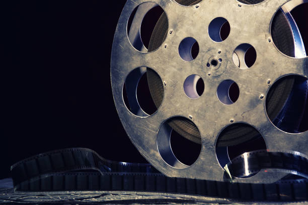 istock 35 mm film reel with dramatic lighting on a dark background 1211111338
