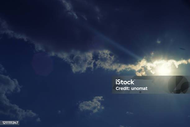 The Sun Shines Bright In Summer Blue Sky And Clouds Stock Photo - Download Image Now