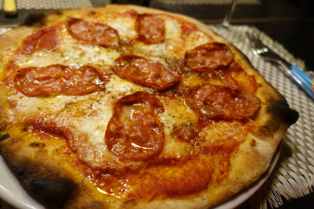 istock cheesy pizza whith spicy salami 1211112885