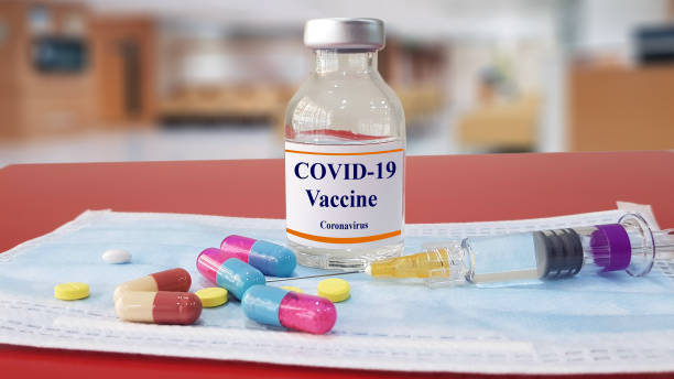 istock Vaccine, medication and syringe injection. It use to prevention,immunization and treatment for new corona virus infection(COVID-19,novel coronavirus disease 2019 or nCoV 2019 Wuhan).Medical concept. 1211115010