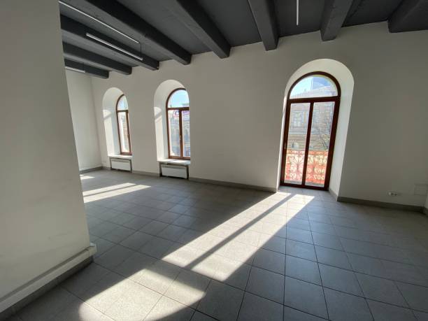 istock designer window in an empty office.  sunlight from the windows 1211115091