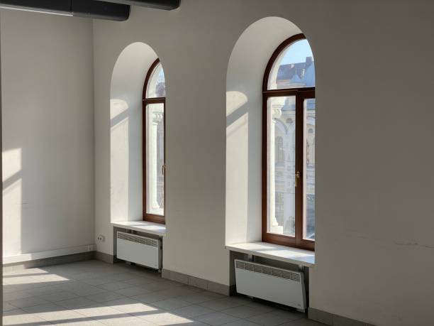 istock designer window in an empty office.  sunlight from the windows 1211115094