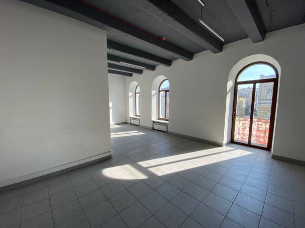 istock designer window in an empty office.  sunlight from the windows 1211115096