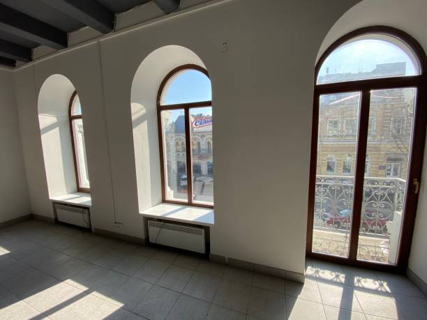 istock designer window in an empty office.  sunlight from the windows 1211115116