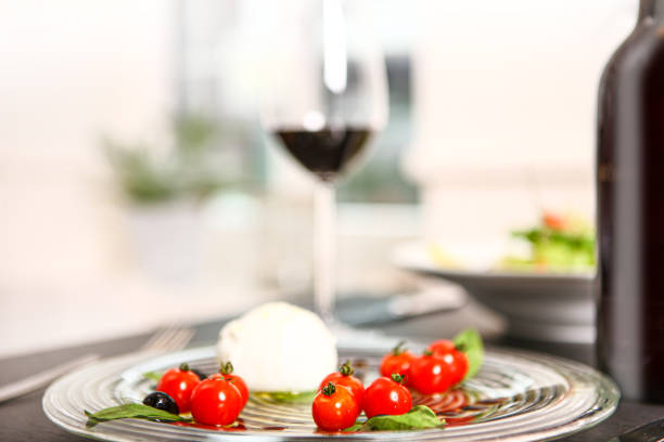 istock salad and red wine and tomato 1211115277