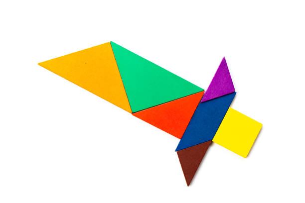 istock Color wood tangram puzzle in sword shape on white background 1211115356