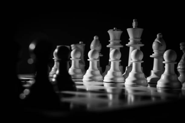 istock Chess figures on a dark background with smoke and fog. Selective focus 1211117106