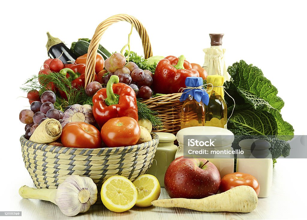 Baskets of raw fruits and vegetables on white background Composition with raw vegetables and wicker basket isolated on white Antioxidant Stock Photo
