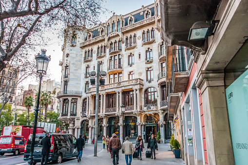 Barcelona, Spain - February 6, 2014: Guests leave Hotel Casa Fuster in Nicolas Salmeron square designed in catalan art nouveau style on February 6, 2014 in Barcelona, Spain.