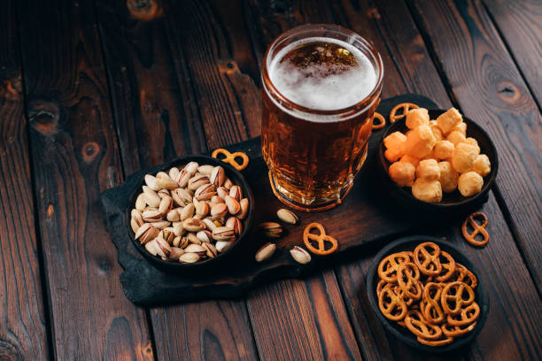 lager beer and salty traditional appetizers beer and snacks. bar table. restaurant, pub, Beer Fest food. friday party atmosphere, craft brewery concept biscuit quick bread photos stock pictures, royalty-free photos & images